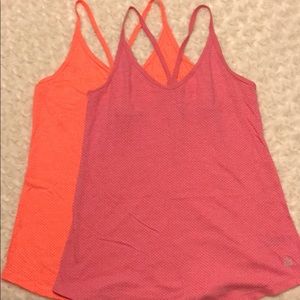 Two VSX workout tanks